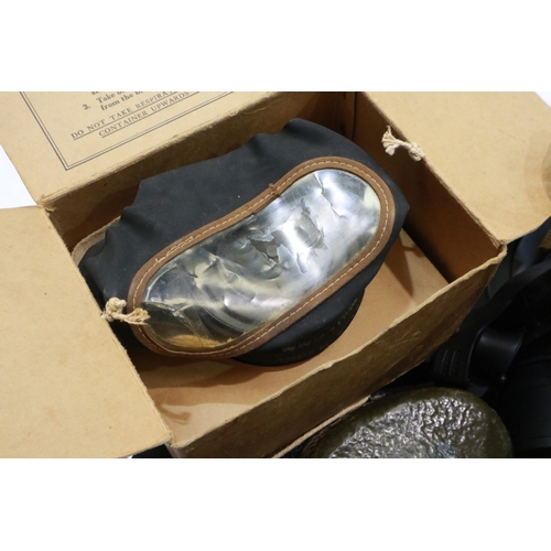 2070 - Box of mixed post-war field equipment, helmets, gas masks, flasks etc. Not available for in-house P&... 
