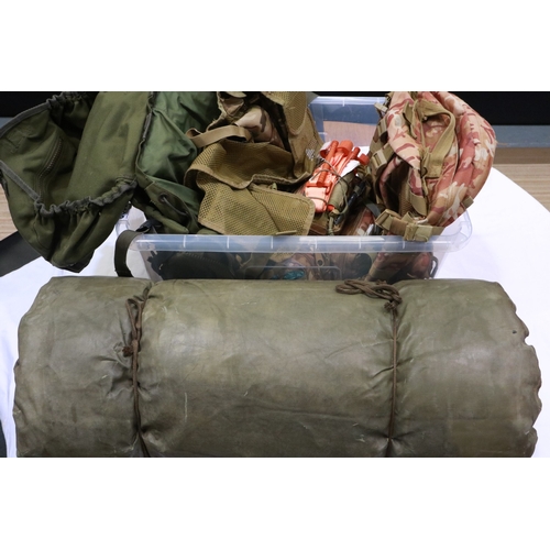 2080 - Shelf of mixed military style survival equipment to include roll-up field bed, rucksacks, survival k... 