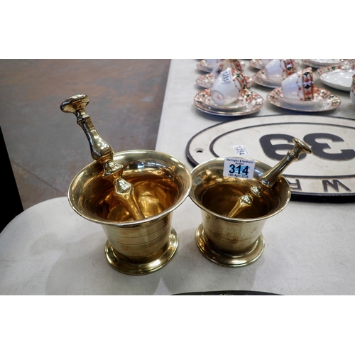 1350 - Two heavy brass mortars and pestle sets. UK P&P Group 3 (£35+VAT for the first lot and £10+VAT for s... 
