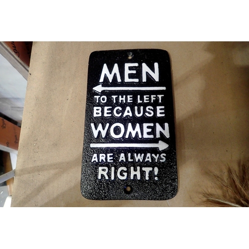 1371 - Cast iron men to the left because women are always right sign, H: 20 cm. UK P&P Group 1 (£18+VAT for... 