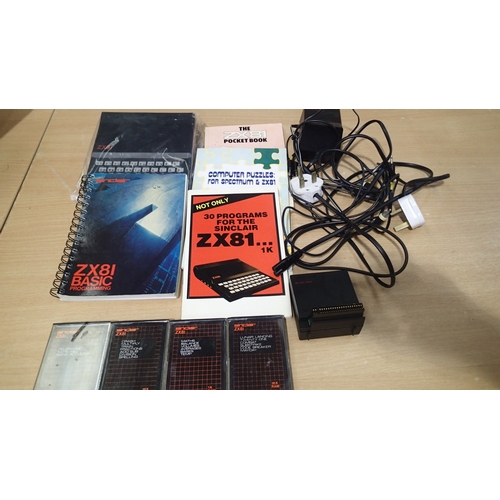 2082 - Sinclair ZX81 with ram, power supply and 4 software cartridges. Not available for in-house P&P. UK P... 