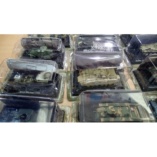 2340 - 40x Magazine issue military vehicles, approx 1/72 scale, all in packs, ex display models. Not availa... 