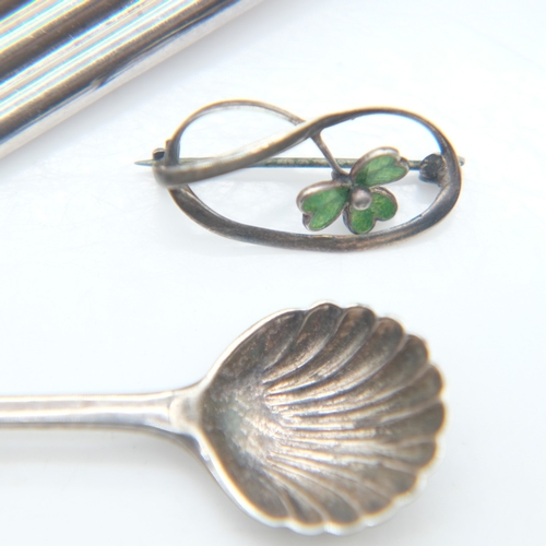101 - Two silver brooches and a silver scalloped spoon, 13g combined. UK P&P Group 0 (£7+VAT for the first... 