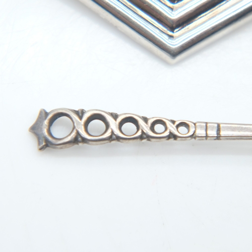 101 - Two silver brooches and a silver scalloped spoon, 13g combined. UK P&P Group 0 (£7+VAT for the first... 