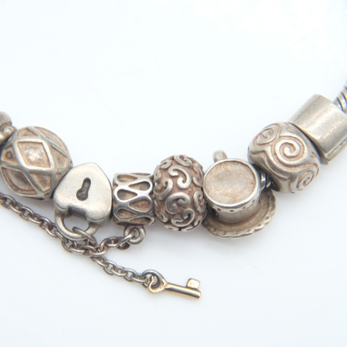 103 - 925 silver Pandora style bracelet with ten charms, 42g. UK P&P Group 0 (£7+VAT for the first lot and... 