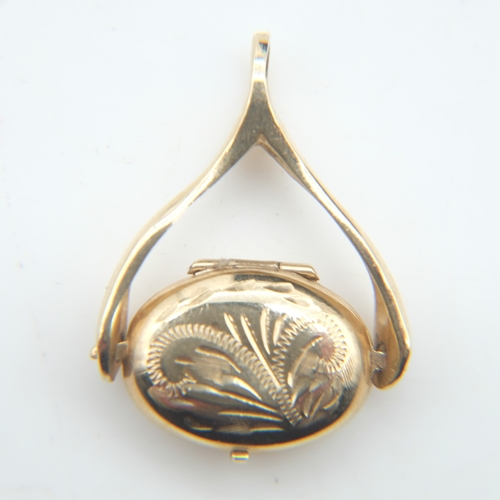 105 - 9ct gold spinner with locket, H: 30 mm, 2.4g. UK P&P Group 0 (£7+VAT for the first lot and £1+VAT fo... 