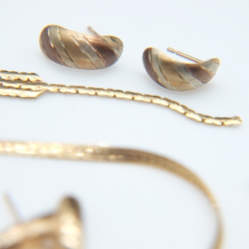 107 - Mix of 9ct gold damaged chains, five pairs of earrings, and one loose earring, 17.4g combined. UK P&... 