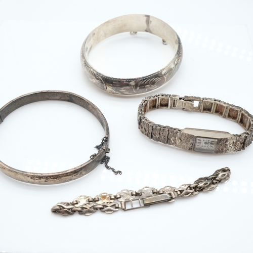 113 - Two silver bangles, a bracelet and a textured Accurist ladies wristwatch, 73g combined. UK P&P Group... 