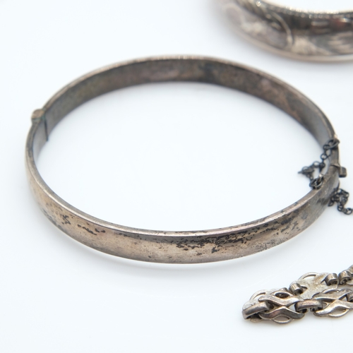 113 - Two silver bangles, a bracelet and a textured Accurist ladies wristwatch, 73g combined. UK P&P Group... 