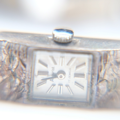 113 - Two silver bangles, a bracelet and a textured Accurist ladies wristwatch, 73g combined. UK P&P Group... 