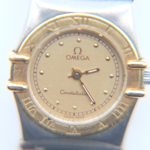 133 - Omega Constellation ladies two-tone steel cased quartz wristwatch, champagne dial and gold-tone beze... 
