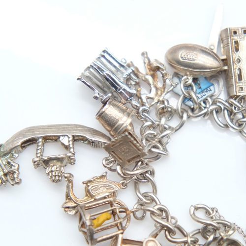 139 - Silver bracelet with twenty charms and padlock clasp, 72g. UK P&P Group 1 (£18+VAT for the first lot... 