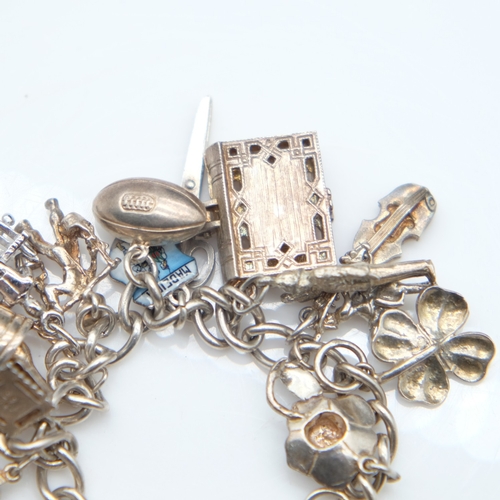 139 - Silver bracelet with twenty charms and padlock clasp, 72g. UK P&P Group 1 (£18+VAT for the first lot... 