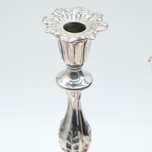146 - Pair of white metal weighted Rococo style candlesticks, H: 25 cm. UK P&P Group 2 (£24+VAT for the fi... 