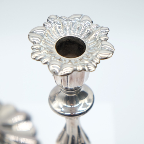 146 - Pair of white metal weighted Rococo style candlesticks, H: 25 cm. UK P&P Group 2 (£24+VAT for the fi... 