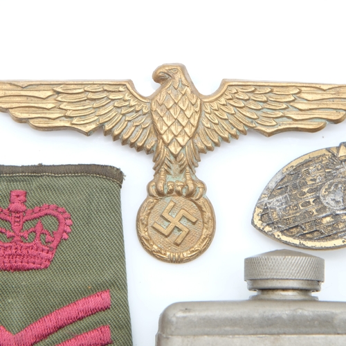 156 - Kriegsmarine tunic breast eagle with a gau badge in semi-relic condition, a Military gun oil bottle ... 