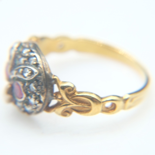 77 - Unmarked 18ct gold ruby and diamond set cluster ring forming an owl head, size N, 4.3g. UK P&P Group... 
