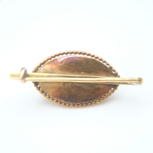 80 - 19th Century unmarked gold brooch, with a domed marquis-shaped glass cabochon with red foiled back s... 