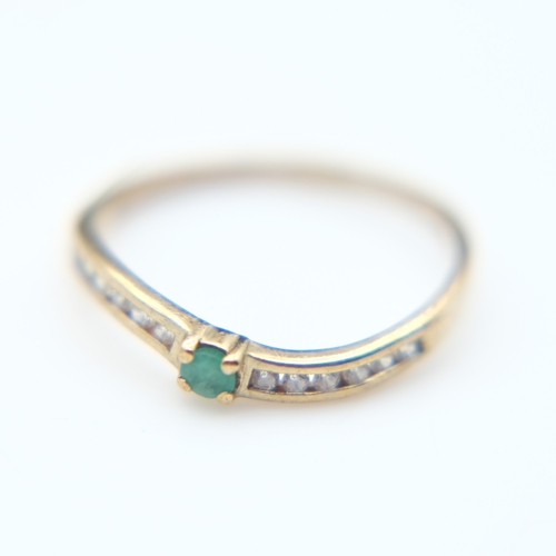 86 - Modern 9ct gold and emerald set solitaire ring with channel-set diamond shoulders, size Q, 1.5g. UK ... 