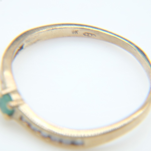 86 - Modern 9ct gold and emerald set solitaire ring with channel-set diamond shoulders, size Q, 1.5g. UK ... 