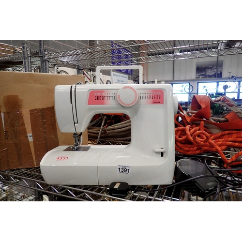 1391 - Toyota RS200 sewing machine with foot pedal and power lead. All electrical items in this lot have be... 