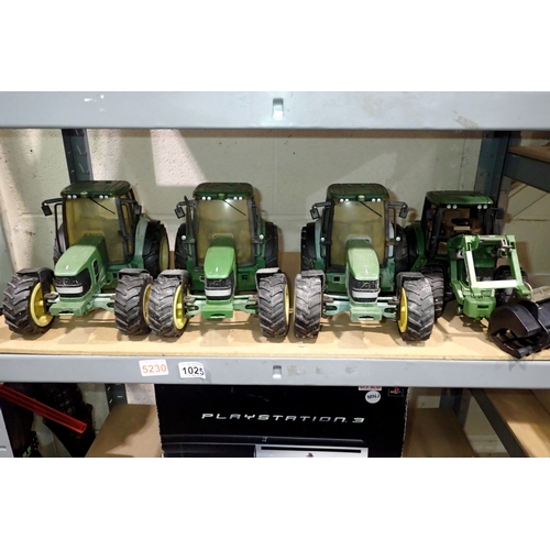 1025 - Three Britain's ERTL tractors and a John Deere tractor. Not available for in-house P&P