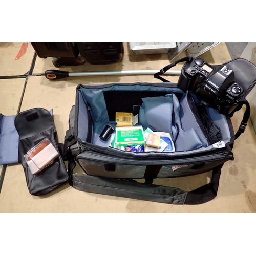 1042 - Nikon F-801S 35mm S.L.R camera (missing lens) with filters, films, bag etc. Not available for in-hou... 