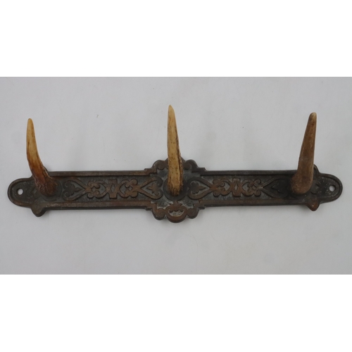 188 - Cast iron and antler coat hanger, L: 32 cm. UK P&P Group 2 (£24+VAT for the first lot and £5+VAT for... 