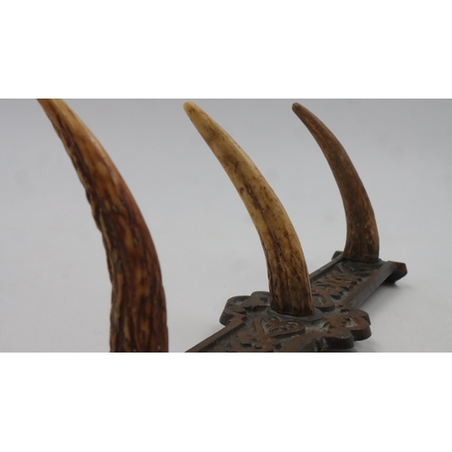 188 - Cast iron and antler coat hanger, L: 32 cm. UK P&P Group 2 (£24+VAT for the first lot and £5+VAT for... 