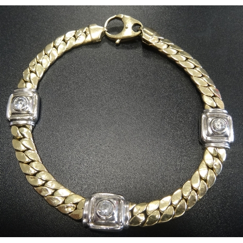 13 - FOURTEEN CARAT TWO TONE GOLD BRACELET
with three CZ set square links in white gold separated by yell... 