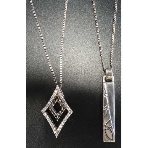 19 - TWO SILVER PENDANTS
one of diamond shape set with marcasite and CZ, the other with motif decoration,... 