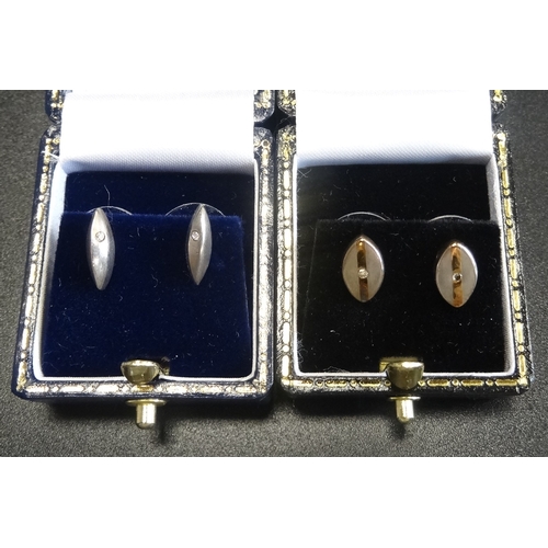 20 - TWO PAIRS OF DIAMOND SET STUD EARRINGS
both in silver and with boxes (2 pairs)  -  RETURNED