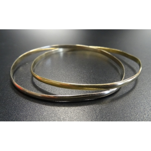 51 - FOURTEEN CARAT GOLD BANGLE
formed as two entwined bangles, approximately 10.9 grams