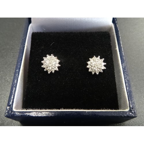 78 - PAIR OF DIAMOND CLUSTER STUD EARRINGS
in nine carat gold