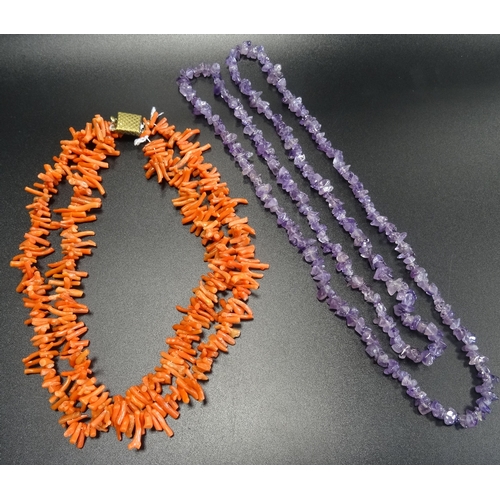 101 - TWO BEAD NECKLACES
comprising an amethyst example and a double strand coral necklace (2)