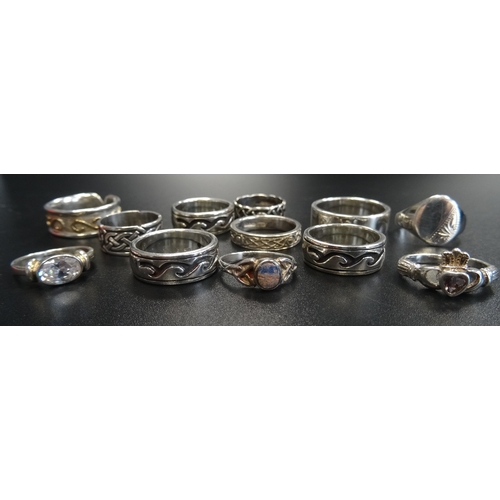 103 - TWELVE SILVER RINGS
of various designs, including a gem set Claddagh ring and Celtic knot decorated ... 