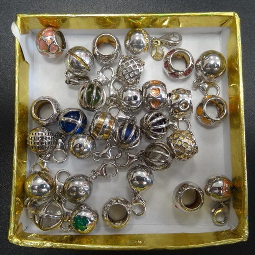 104 - LARGE SELECTION OF SILVER BALL CHARMS
of various designs including enamel decorated and cage design ... 