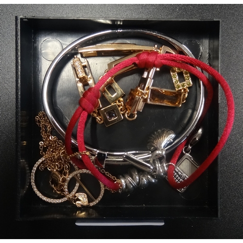 135 - SELECTION OF FASHION JEWELLERY  
comprising a Michael Kors buckle design bangle; a Swarovski crystal... 