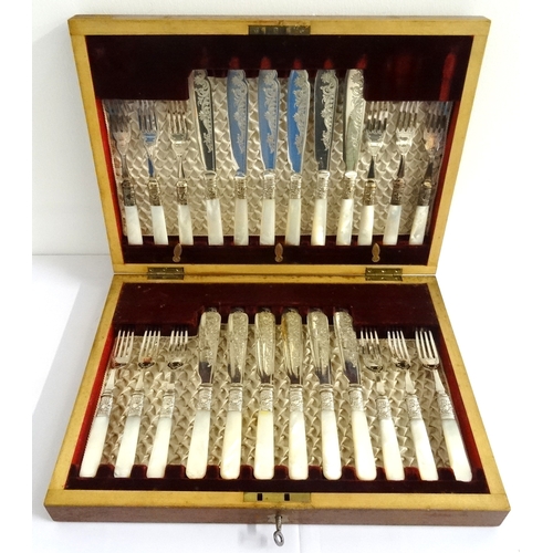 158 - MAHOGANY CASED SET OF FISH CUTLERY 
comprising twelve fish knives and forks with mother of pearl han... 