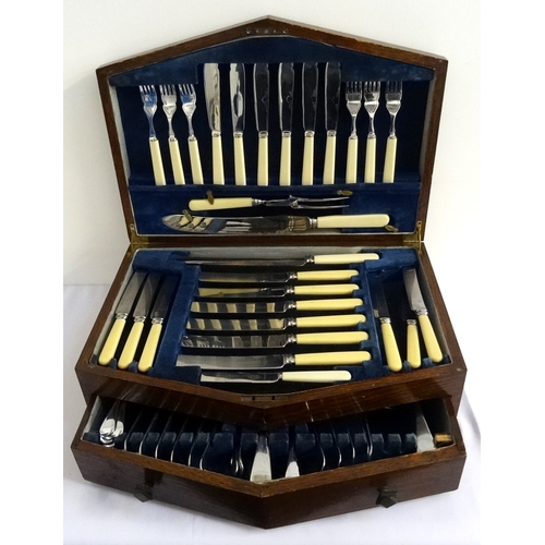 159 - OAK CASED CANTEEN OF CUTLERY 
comprising six place settings of fish knives and forks, table knives a... 