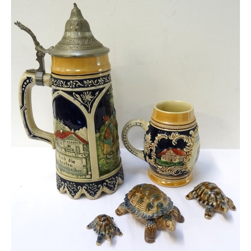 184 - THREE GRADUATED WADE TORTOISES
decorated in brown and blue, a musical stein with a pewter lid, the b... 