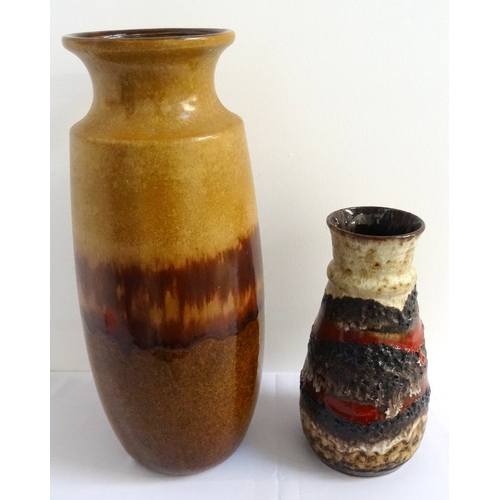 193 - TWO WEST GERMAN VASES
comprising a brown slip ware vase with a flared rim, the base impressed '239-4... 