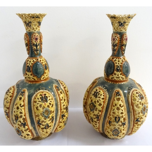 208 - PAIR OF HIGHLY DECORATIVE ZSOLNAY PECS PIERCED POTTERY BOTTLE VASES
the pierced flared rim on each a... 