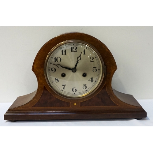 218 - SHAPED MAHOGANY AND INLAID MANTLE CLOCK
the circular silvered dial with Arabic numerals and an eight... 