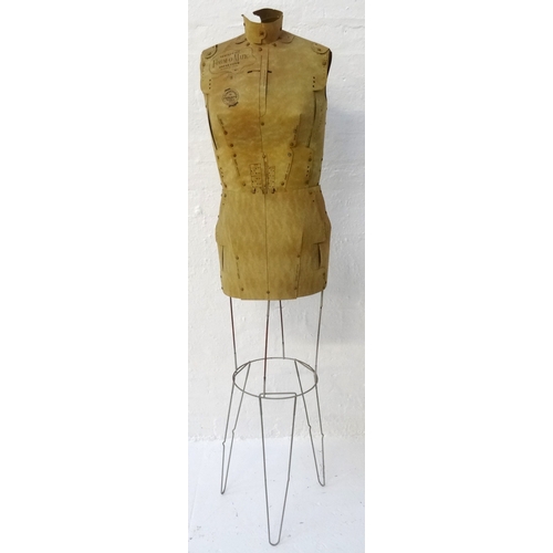 219 - 1950'S ADJUSTABLE CARD MANNEQUIN
on a metal frame and marked to the body 'Perfect Fit Form-O-Matic D... 