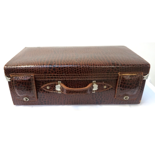 220 - LEATHER CROCODILE EFFECT SUITCASE
with a carry handle and fold over leather lock covers, with a part... 