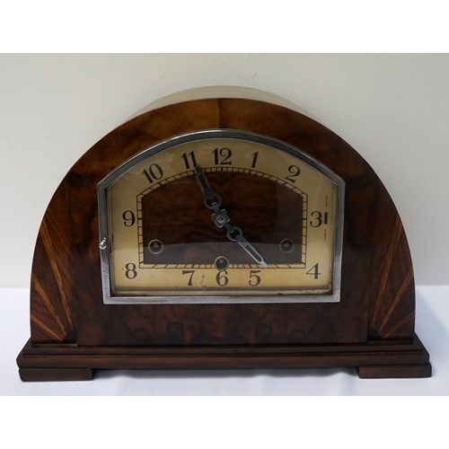 226 - WALNUT AND FIGURED WALNUT MANTLE CLOCK
in an arched case, the shaped dial with Arabic numerals and t... 