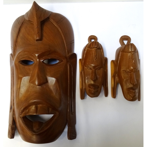 263 - AFRICAN CARVED HARDWOOD TRIBAL MASK
depicting a warrior, with cut out eyes and mouth, 36.5cm high, t... 