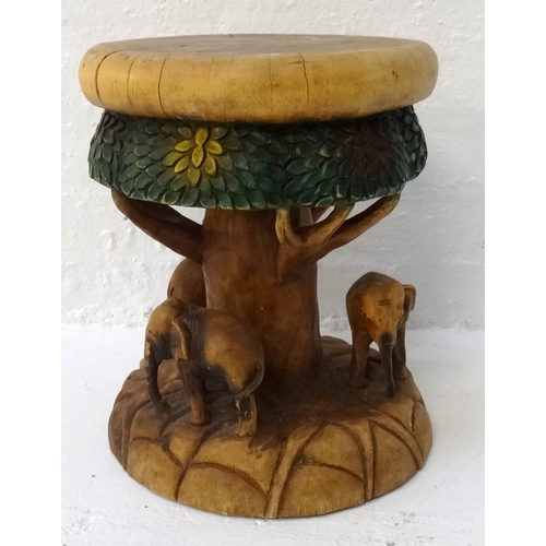 398 - CARVED ELM STOOL
with a circular seat and frieze carved to represent a tree and its canopy, with thr... 