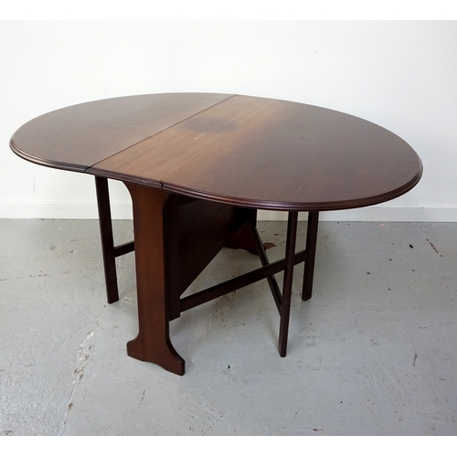 435 - MAHOGANY GATE LEG DINING TABLE
with shaped drop flaps, standing on shaped supports, 105cm wide